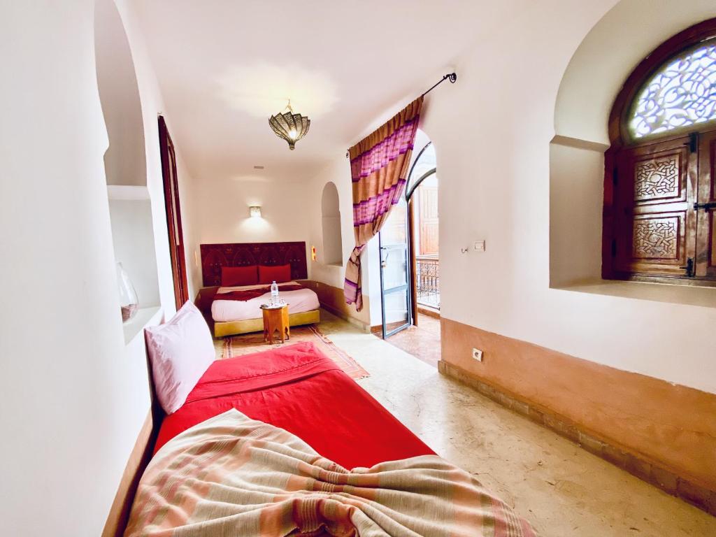 Postel nebo postele na pokoji v ubytování Riad Prada