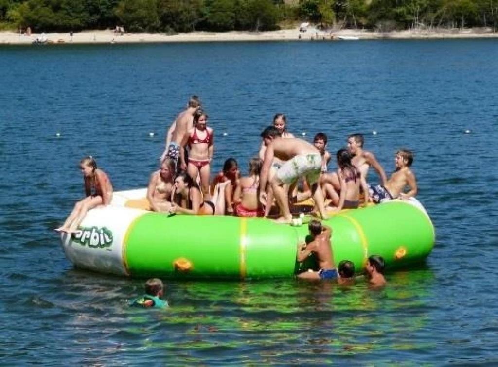 a group of people sitting on an inflatable at Mobilhome 3 étoiles - efb0fh in Canet-de-Salars