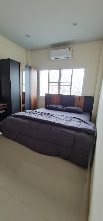 Postel nebo postele na pokoji v ubytování TM Touch Homestay