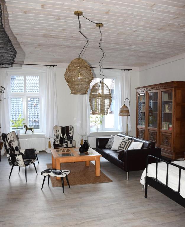 a living room with a couch and a table at Apartament w Fabryce Czekolady in Bytom