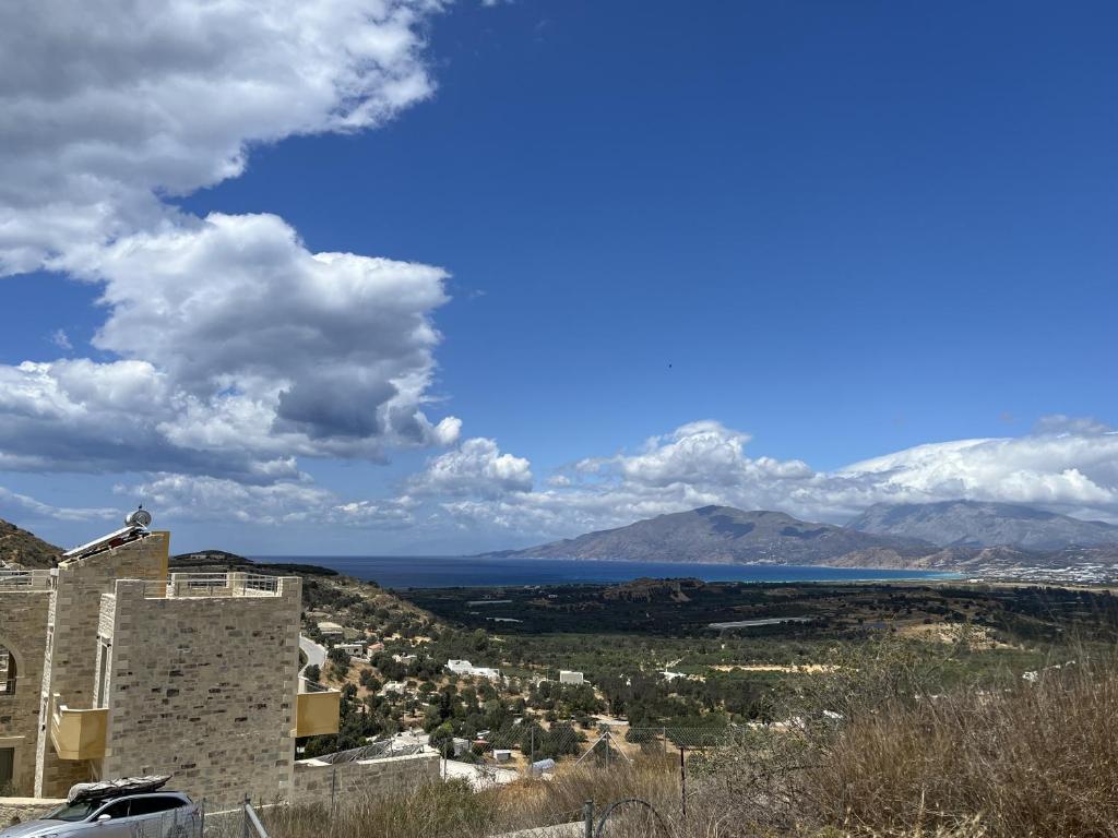 a view of the ocean from a building at Spitiko Apartment 1 in Kamilari