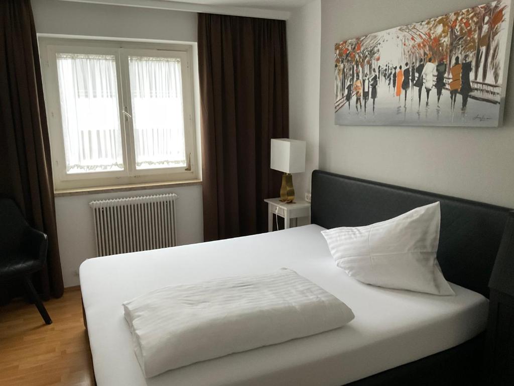 Postel nebo postele na pokoji v ubytování Hotel Berg