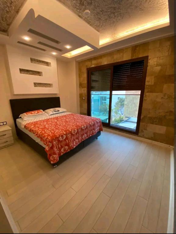 Postel nebo postele na pokoji v ubytování My world rezidans villaları 2 no lu villa