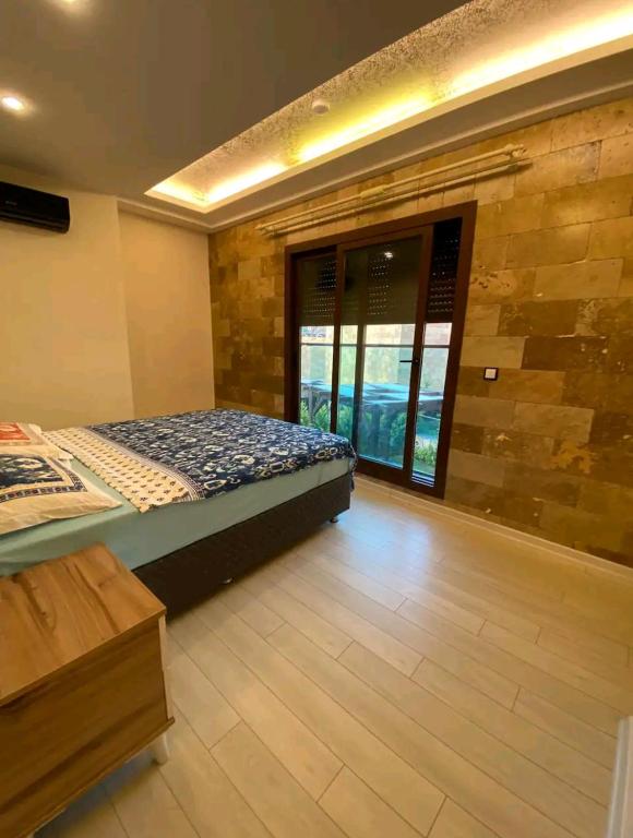 Postel nebo postele na pokoji v ubytování My world rezidans villaları 2 no lu villa