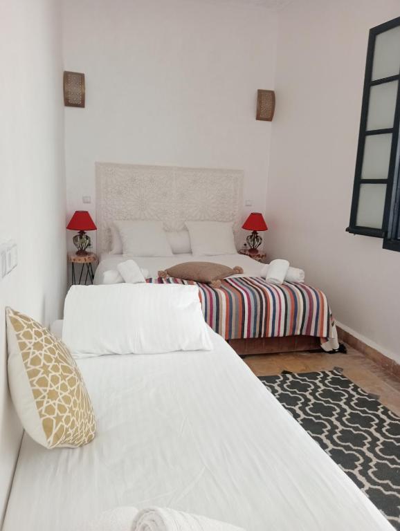 Postel nebo postele na pokoji v ubytování Le riad de l'étoile ocre - COTG