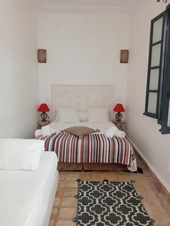 Postel nebo postele na pokoji v ubytování Le riad de l'étoile ocre - COTG