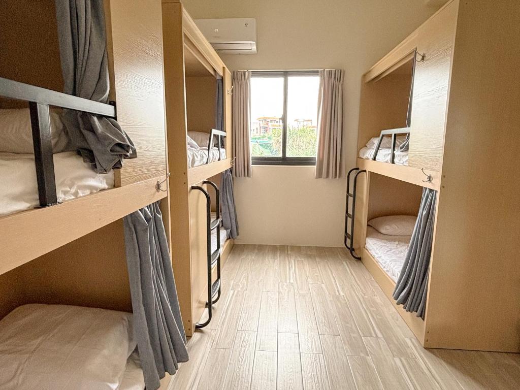 Postel nebo postele na pokoji v ubytování Lunos homestay