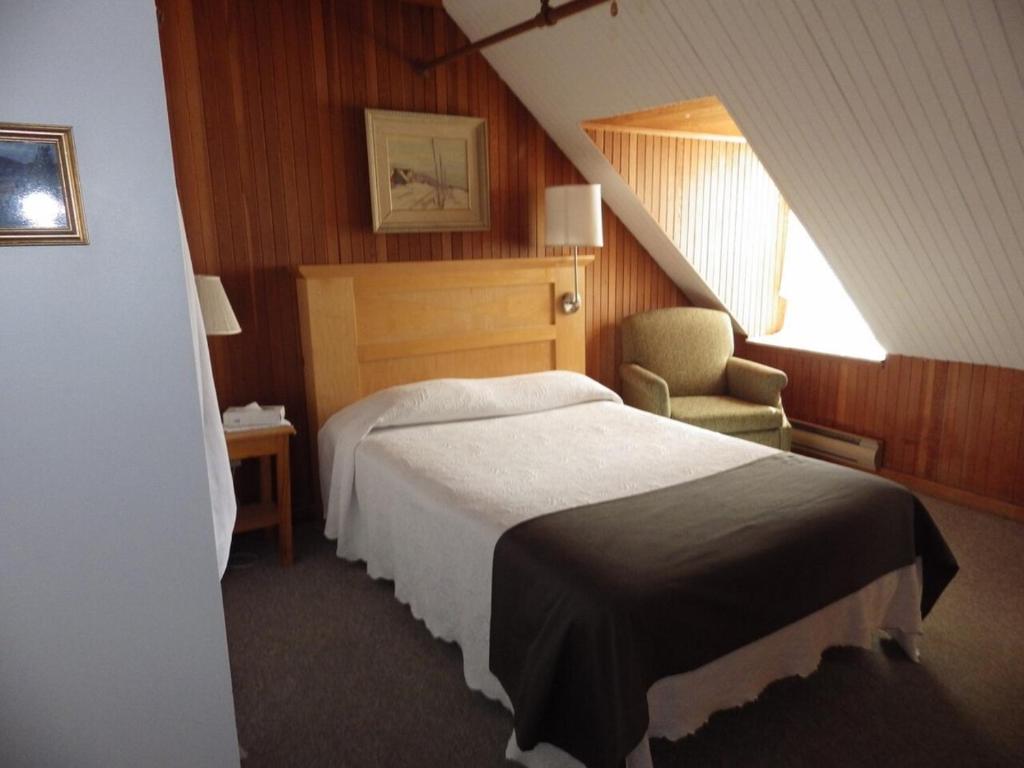 Postel nebo postele na pokoji v ubytování Manoir Charlevoix