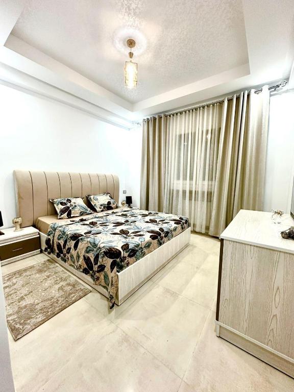 Postel nebo postele na pokoji v ubytování Charmant Appartement à Hammamet- Résidence Bousten 2