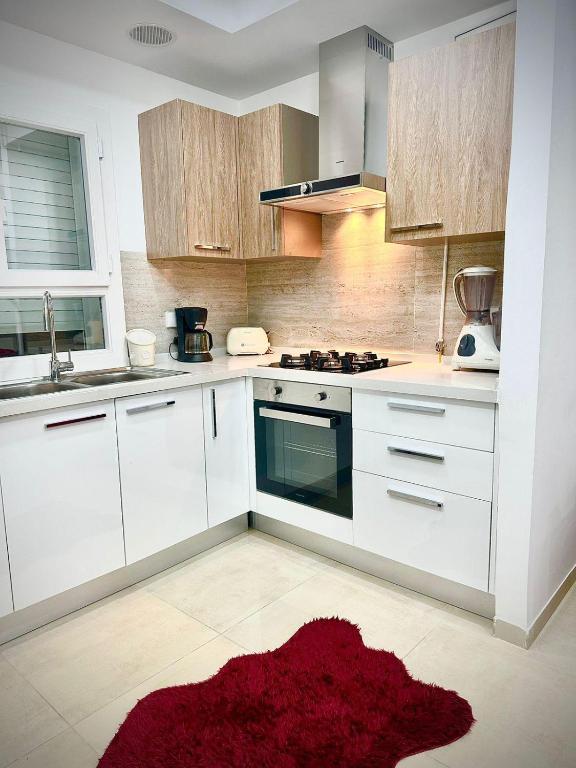 Kuchyň nebo kuchyňský kout v ubytování Charmant Appartement à Hammamet- Résidence Bousten 2