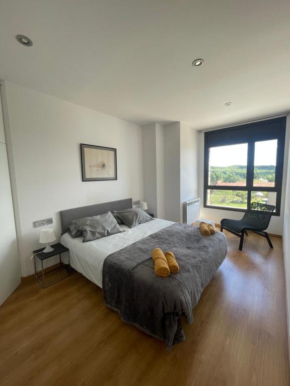 a bedroom with a large bed and a large window at Apartamento en Olvan 3 - ALBERGA in Olvan