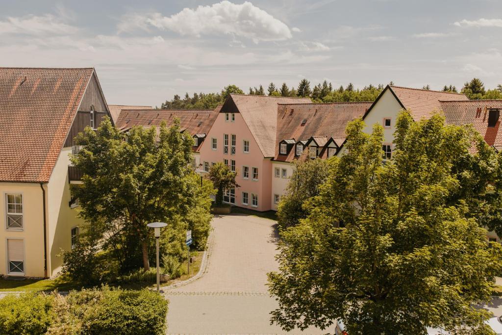 a street in a town with houses and trees at OG Ferienwohnung 4 Personen 2 in Rieden