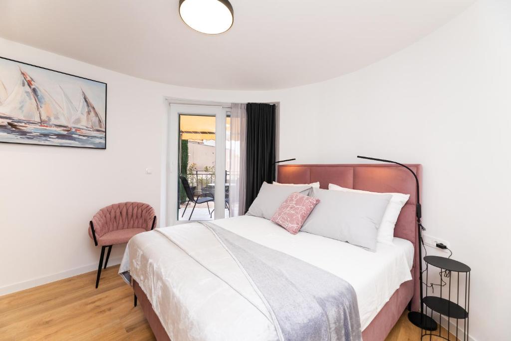 Postel nebo postele na pokoji v ubytování Scaletta Rooms