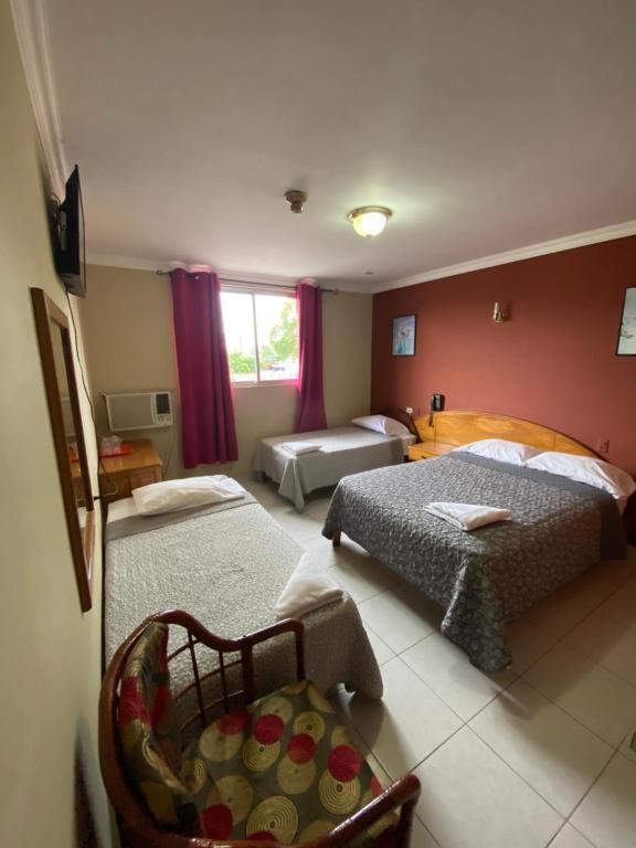 Postel nebo postele na pokoji v ubytování Hotel Toledo