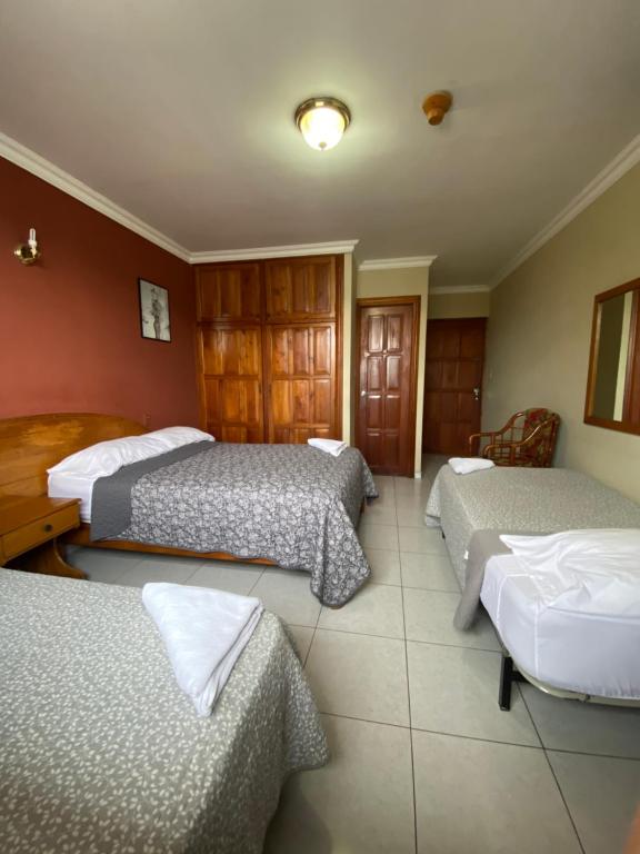 Postel nebo postele na pokoji v ubytování Hotel Toledo