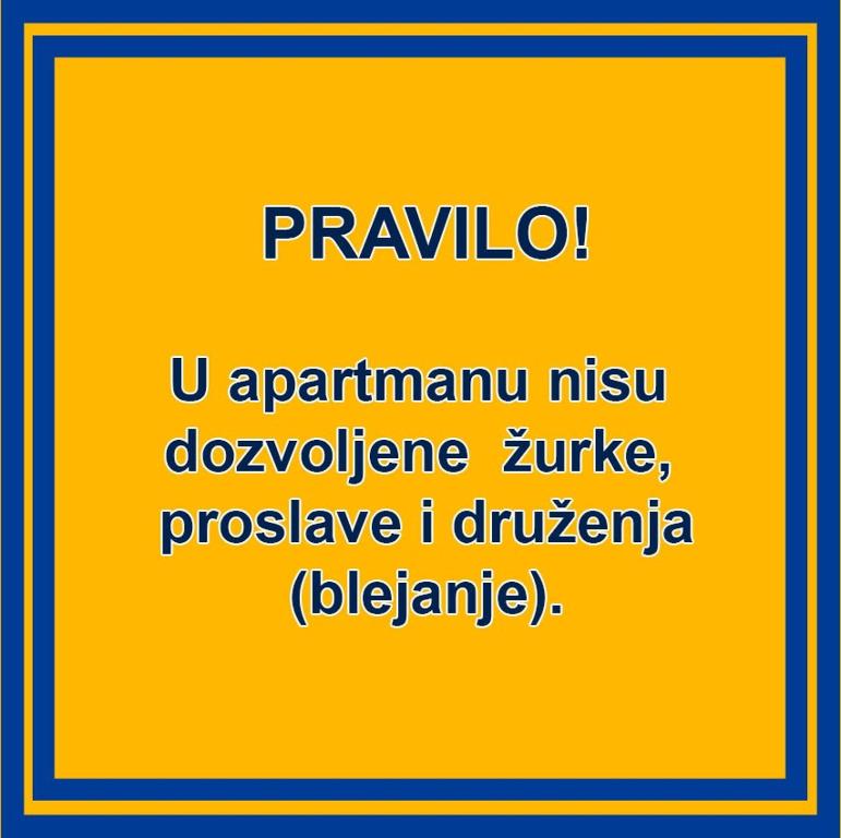a yellow sign with the words istgivanivanivanivanholmivanholmivanivan at Ana Apartment in Novi Sad