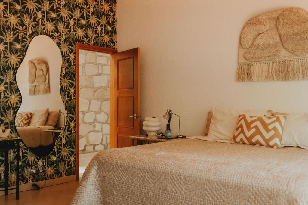 En eller flere senge i et værelse på Finca Los tocayos Privada con alberca climatizada