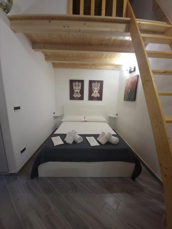 Ένα ή περισσότερα κρεβάτια σε δωμάτιο στο Casa Vacanze Giorgia