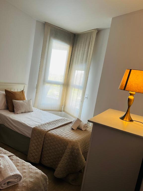 Postel nebo postele na pokoji v ubytování Travel Habitat - Ciudad de las Ciéncias