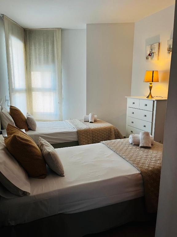 Postel nebo postele na pokoji v ubytování Travel Habitat - Ciudad de las Ciéncias