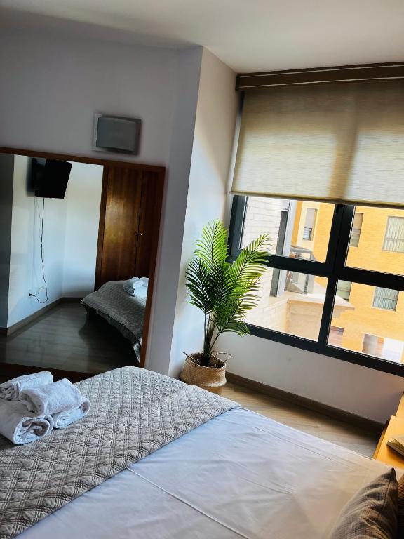 Postel nebo postele na pokoji v ubytování Travel Habitat - Ciudad de las Ciéncias