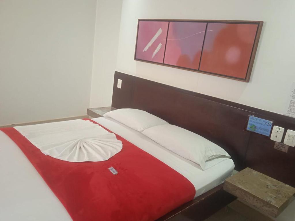Postel nebo postele na pokoji v ubytování Hotel Romanza