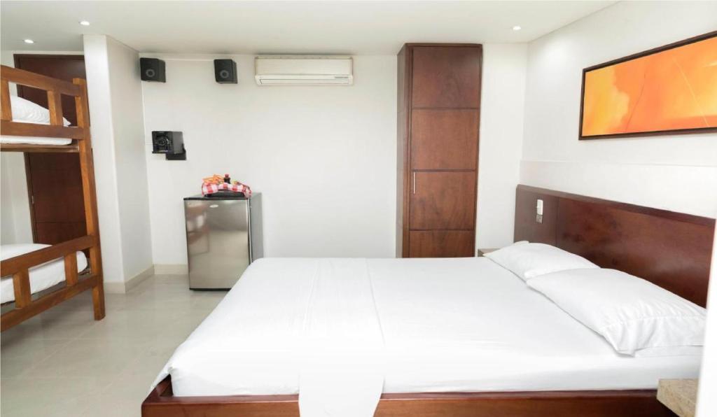 Postel nebo postele na pokoji v ubytování Hotel Romanza