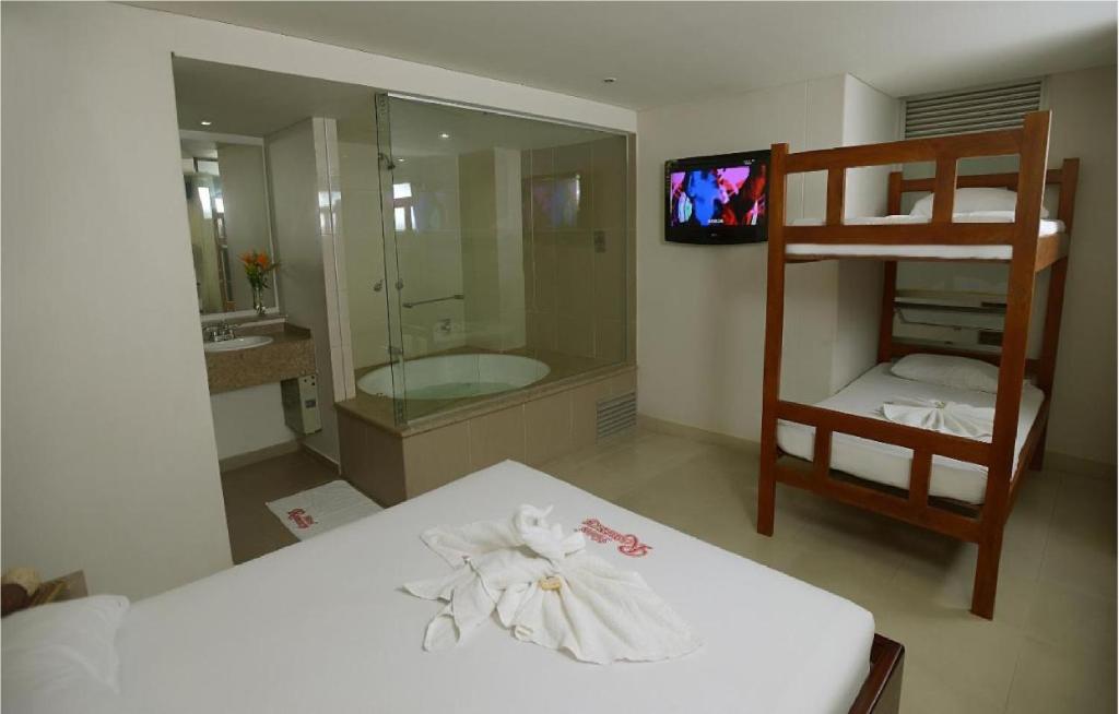 Postel nebo postele na pokoji v ubytování Hotel Romanza