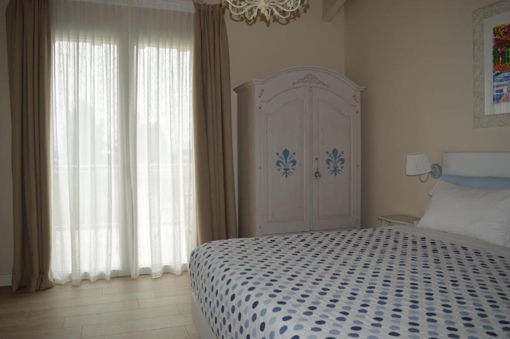 Łóżko lub łóżka w pokoju w obiekcie B&B La Fiaba