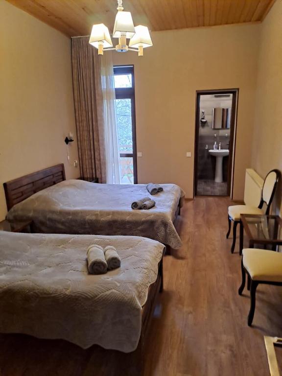 Postel nebo postele na pokoji v ubytování Guest House Kaldani
