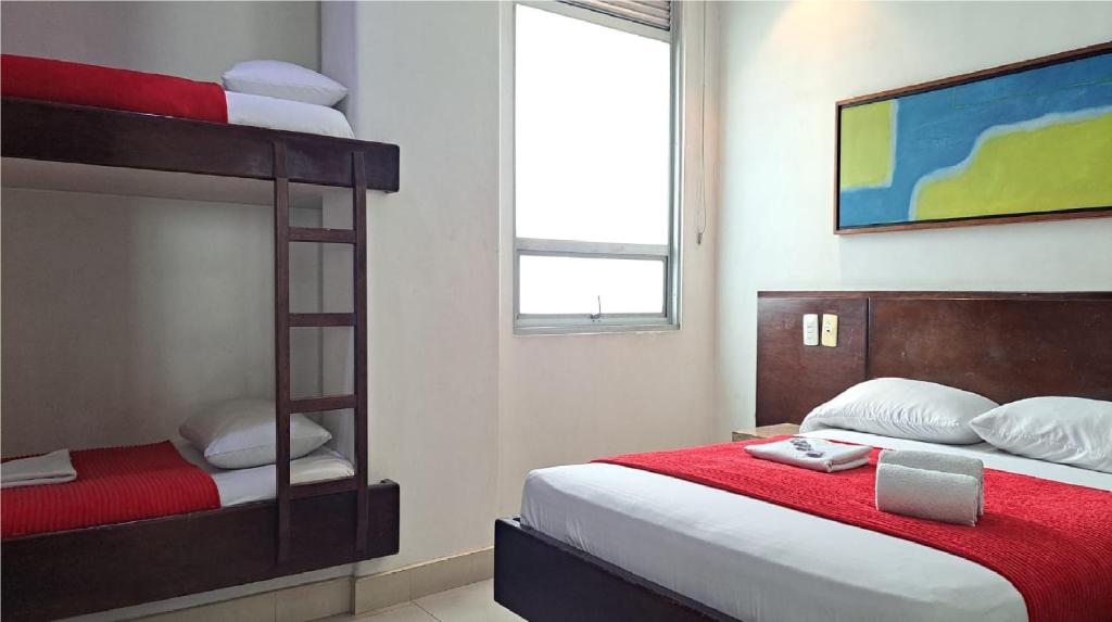 Postel nebo postele na pokoji v ubytování Hotel Romanza