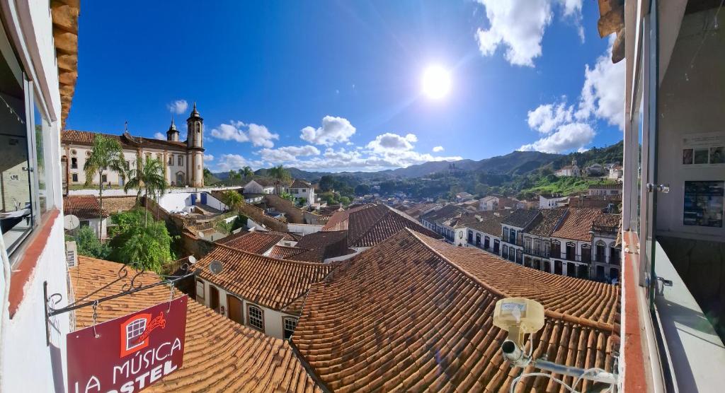 a view of the roofs of a town at La Musica Hostel OuroPreto in Ouro Preto