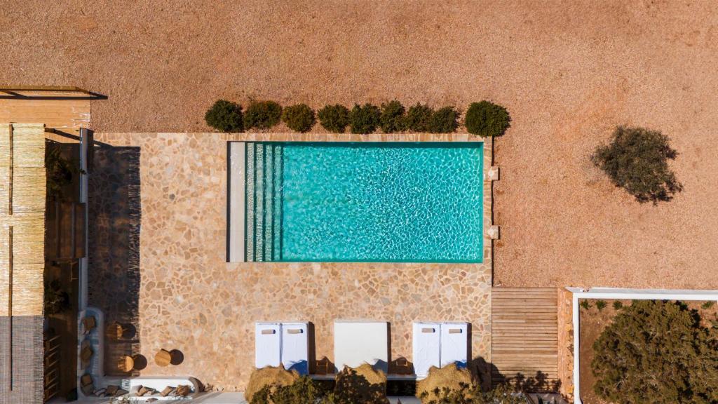 an overhead view of a swimming pool in a building at Estel Formentera in Playa Migjorn