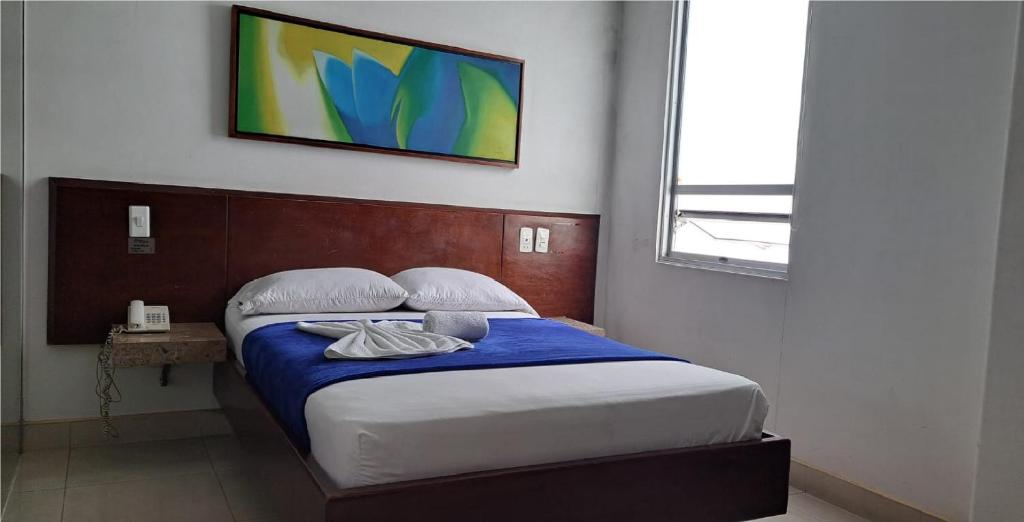 Postel nebo postele na pokoji v ubytování Hotel Romanza