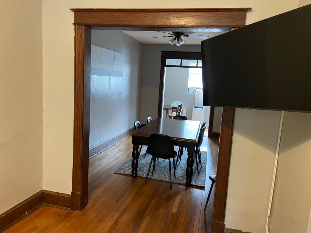 a dining room with a table and a television at 3 BR TH fee Parking Walk 2 Metro in Washington