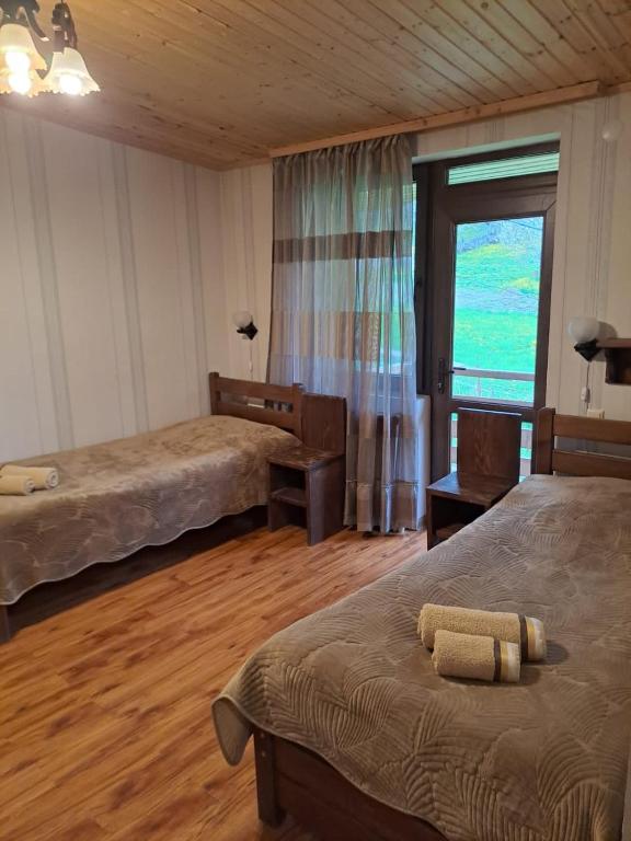 Postel nebo postele na pokoji v ubytování Guest House Kaldani