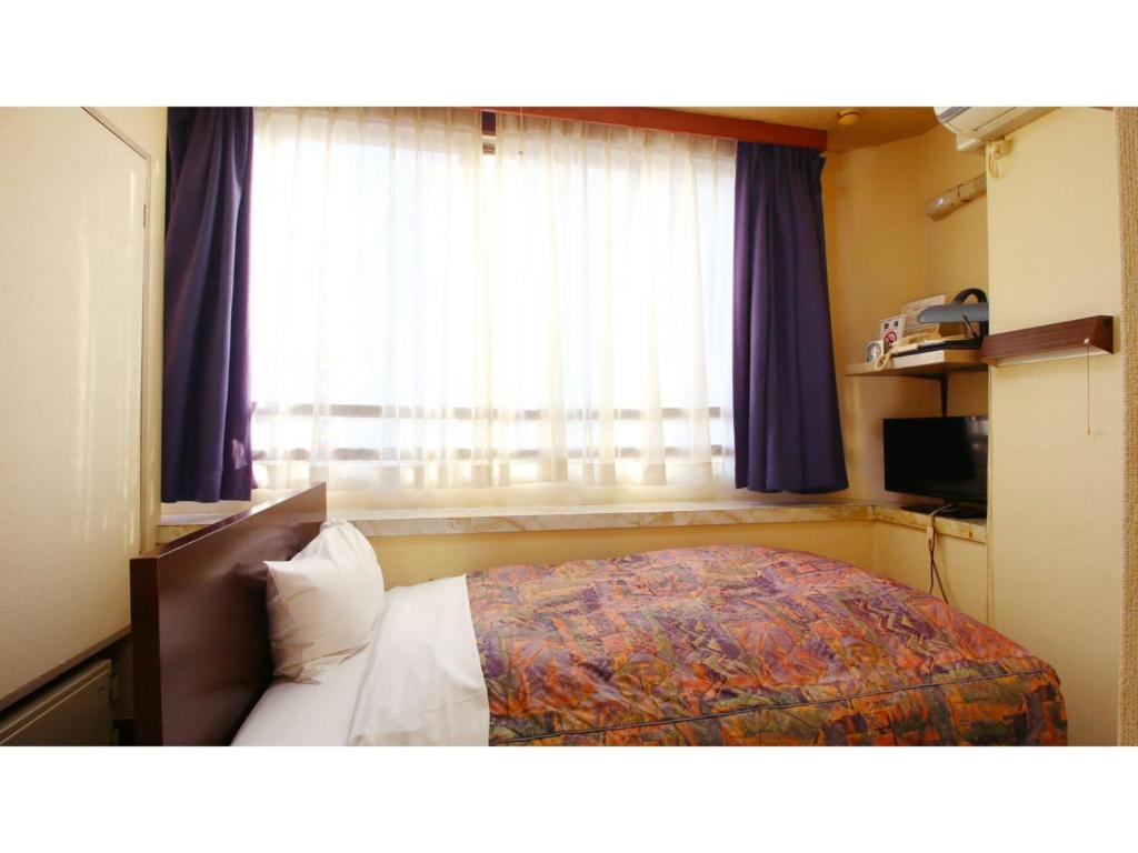 Ένα ή περισσότερα κρεβάτια σε δωμάτιο στο Hotel Itakura - Vacation STAY 70021v