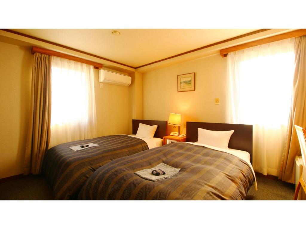 Ένα ή περισσότερα κρεβάτια σε δωμάτιο στο Hotel Itakura - Vacation STAY 70102v