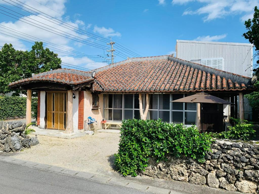 a small house with a tiled roof at Minshuku Kunya - Vacation STAY 70157v in Fukai