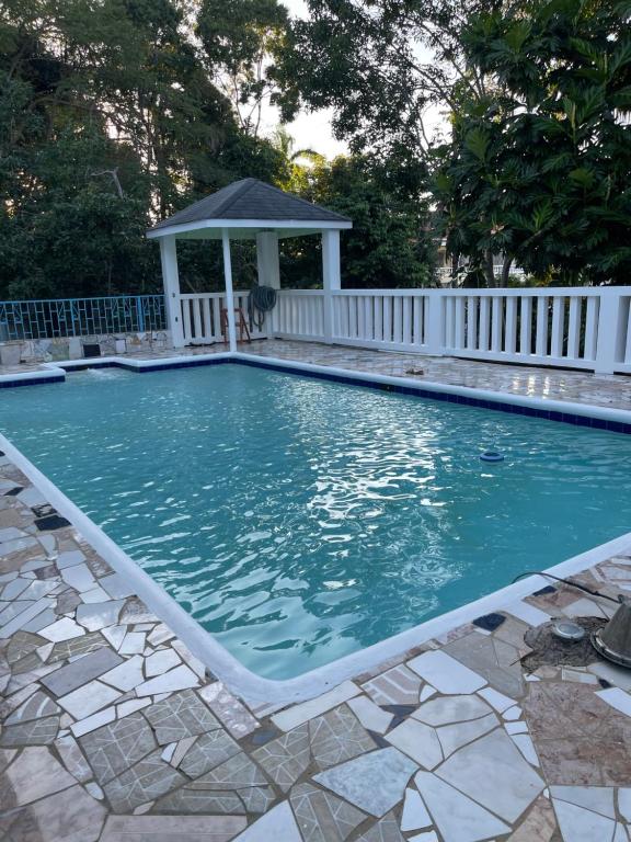 una piscina con gazebo di Peaceful Home With Private Pool! a Montego Bay