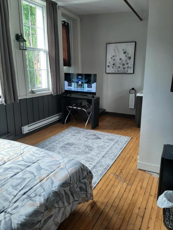 Postel nebo postele na pokoji v ubytování Manoir Charlevoix