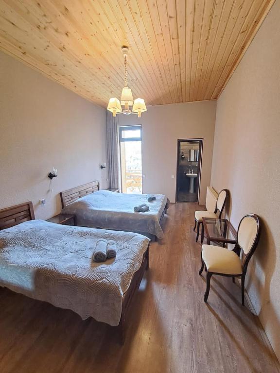Postel nebo postele na pokoji v ubytování Guest House Kaldani