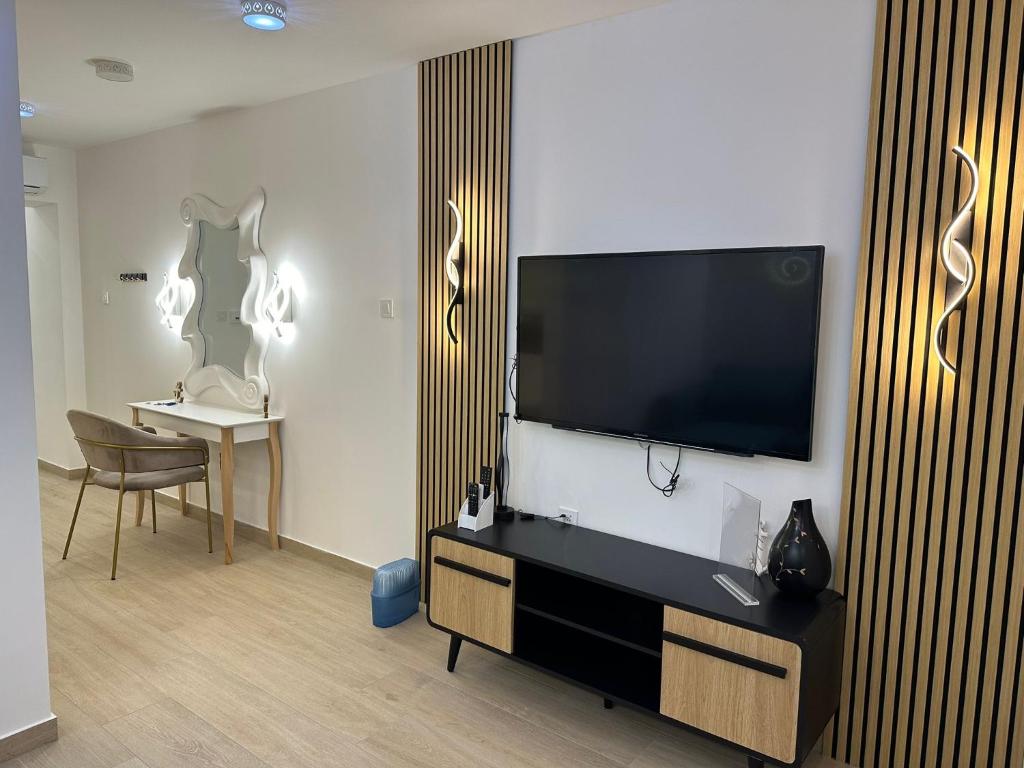 TV a/nebo společenská místnost v ubytování Guest House Sidro