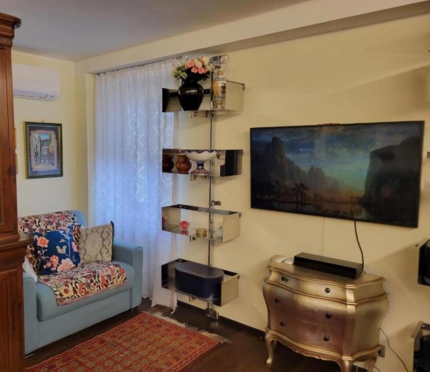 A television and/or entertainment centre at Verona City San Zeno Apartment