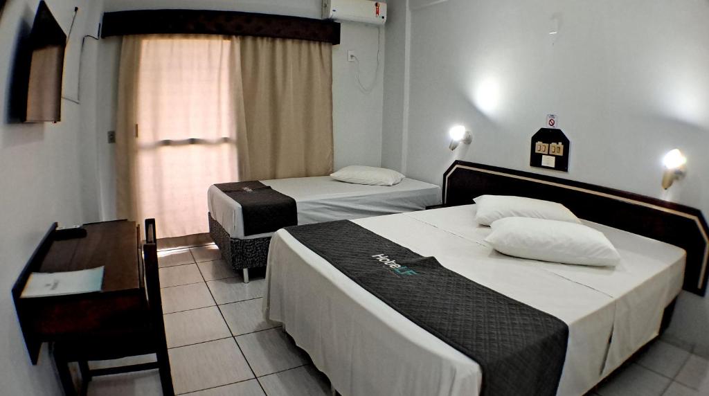 Postel nebo postele na pokoji v ubytování Hotel LF By Feliciano