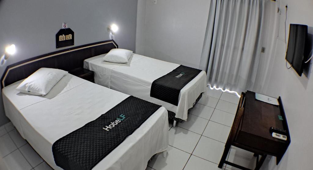 Postel nebo postele na pokoji v ubytování Hotel LF By Feliciano