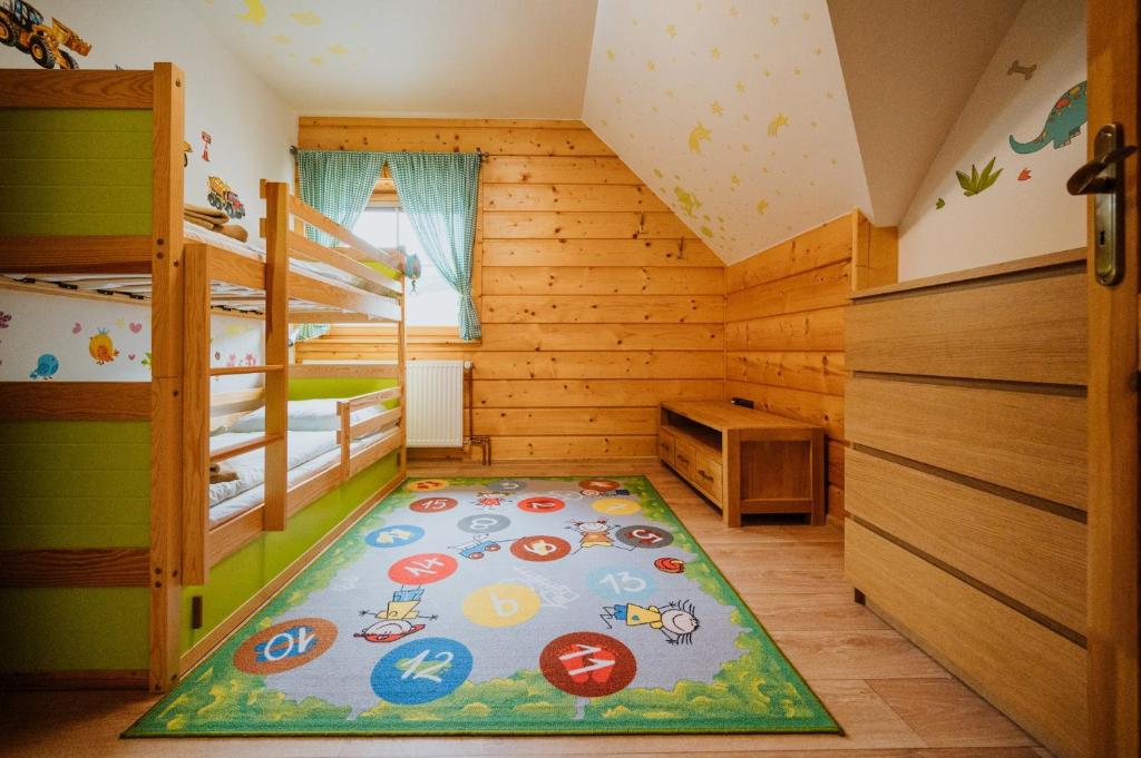 Postel nebo postele na pokoji v ubytování Apartmány Velké Karlovice