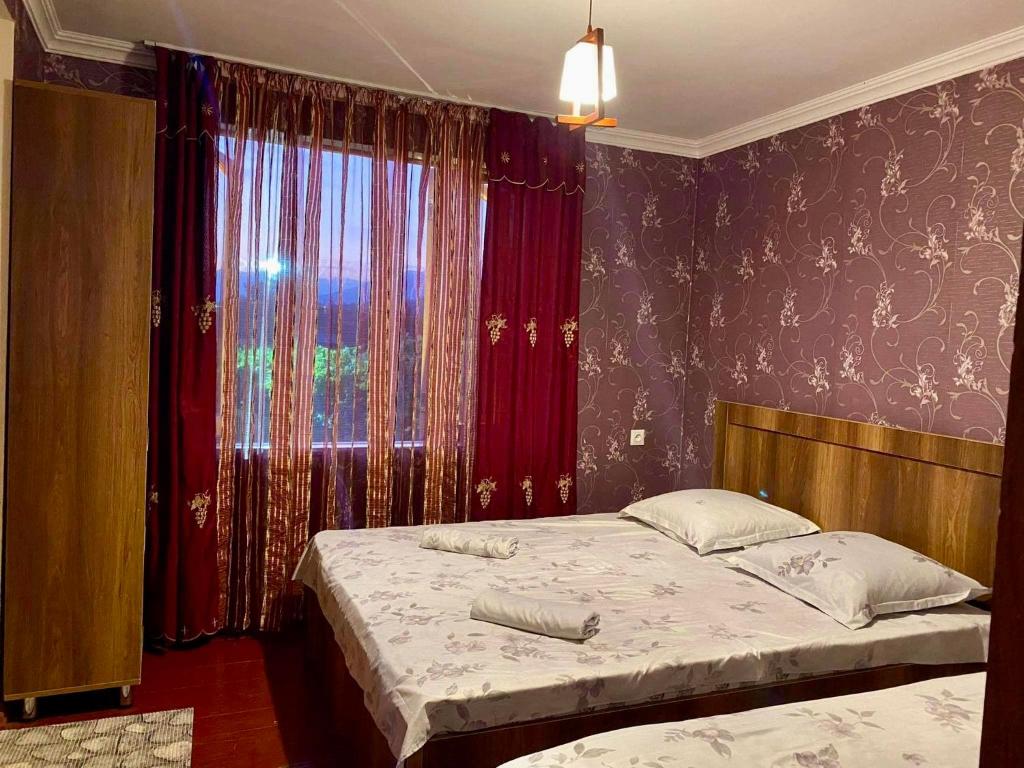 Postel nebo postele na pokoji v ubytování Guesthouse Dadia