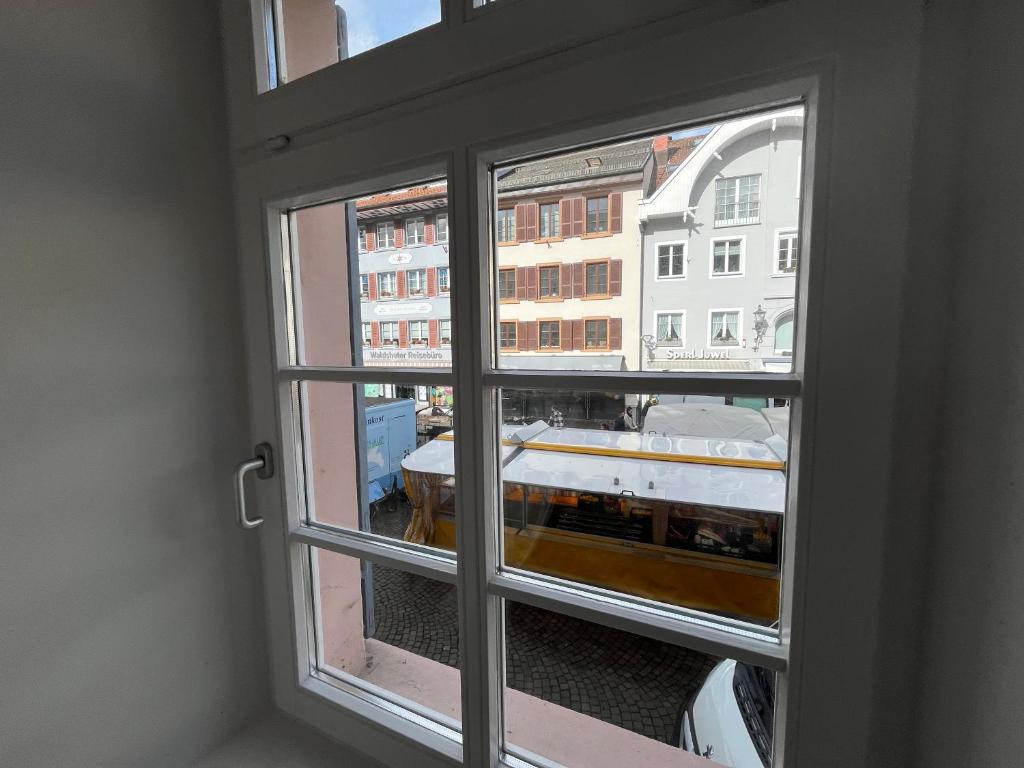 a window with a view of a boat seen through it at Waldshut -Kaiser55 in Waldshut-Tiengen