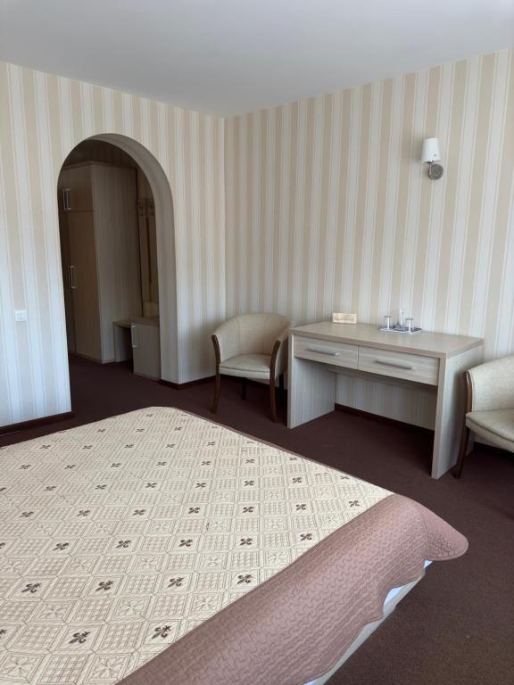 Postel nebo postele na pokoji v ubytování Ideal Predeal